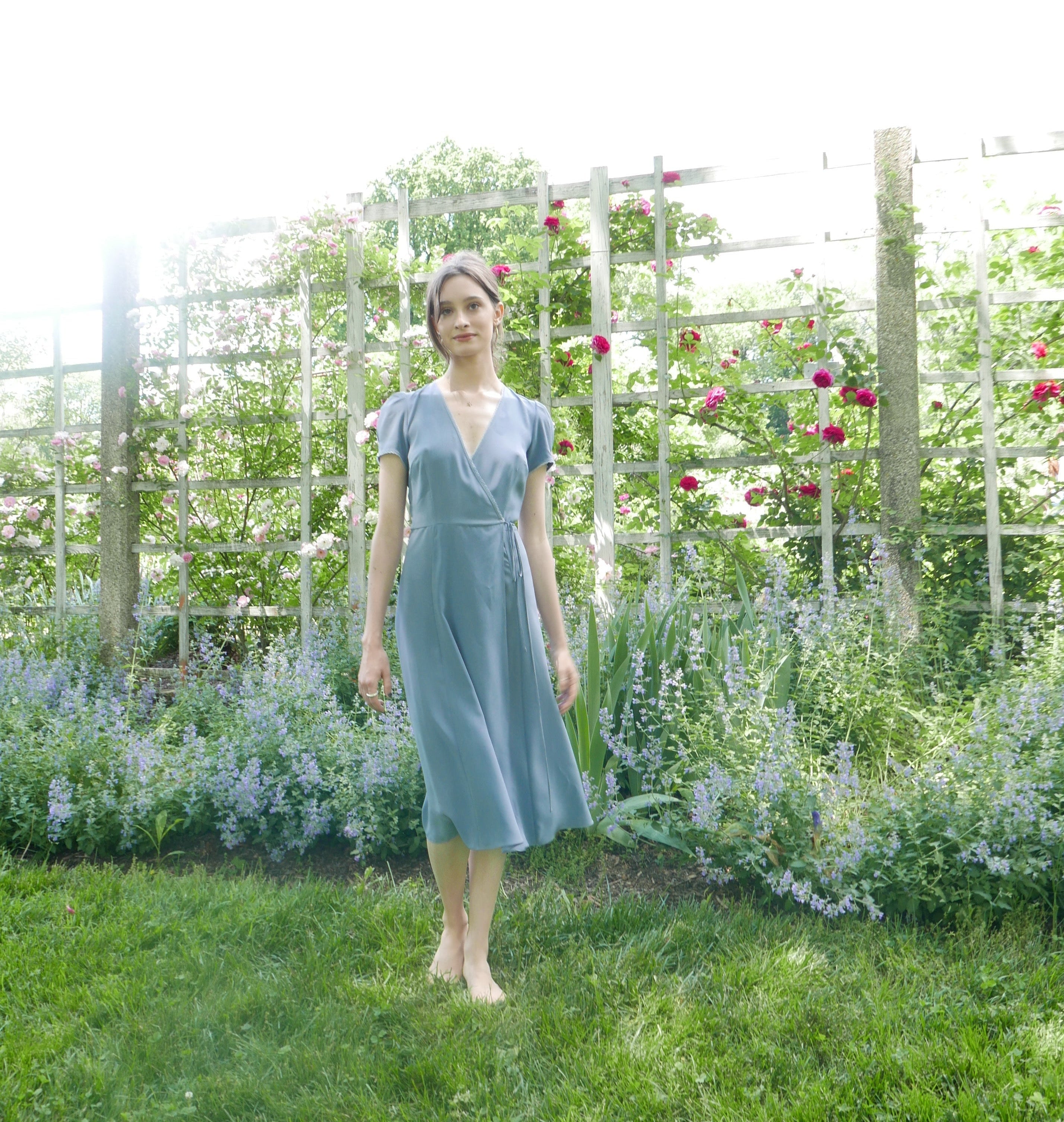 Front view of lavender blue silk wrap midi dress.