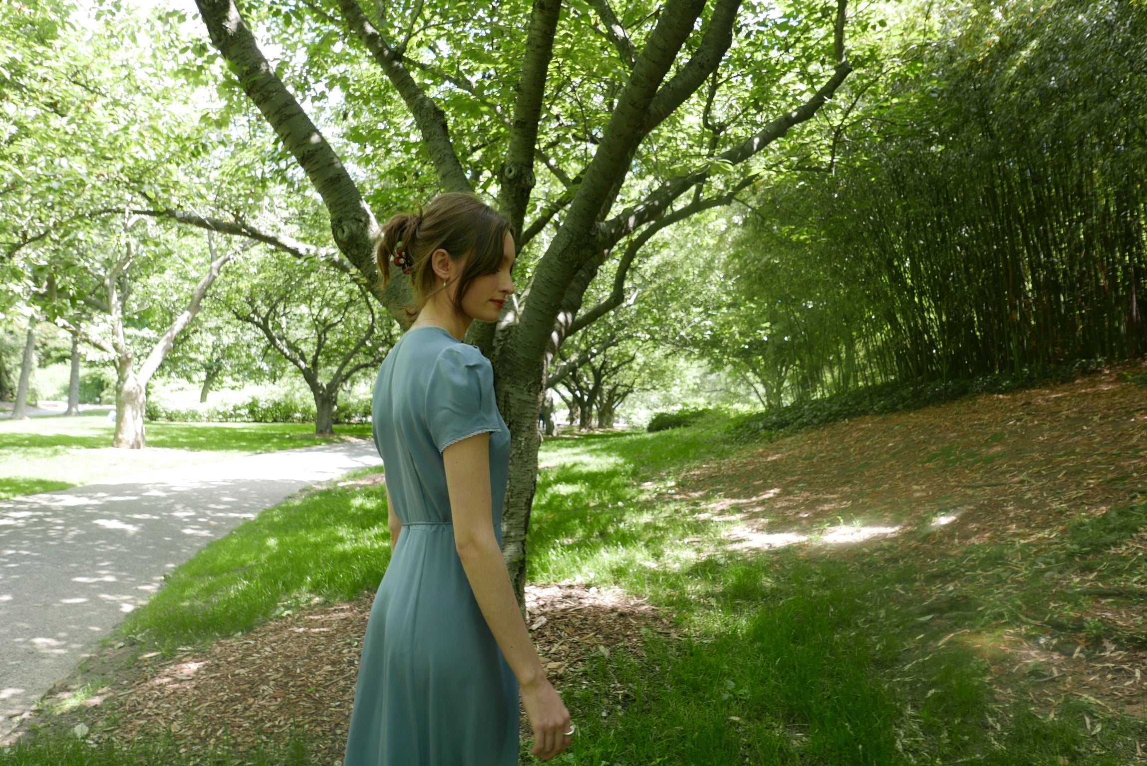 Side details of lavender blue silk midi dress with hand dyed lace trim. 